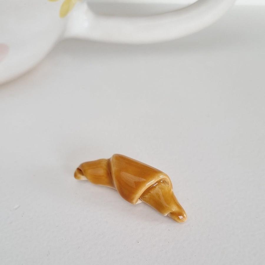 Ceramic croissant. Comes with a handmade croissant mug
