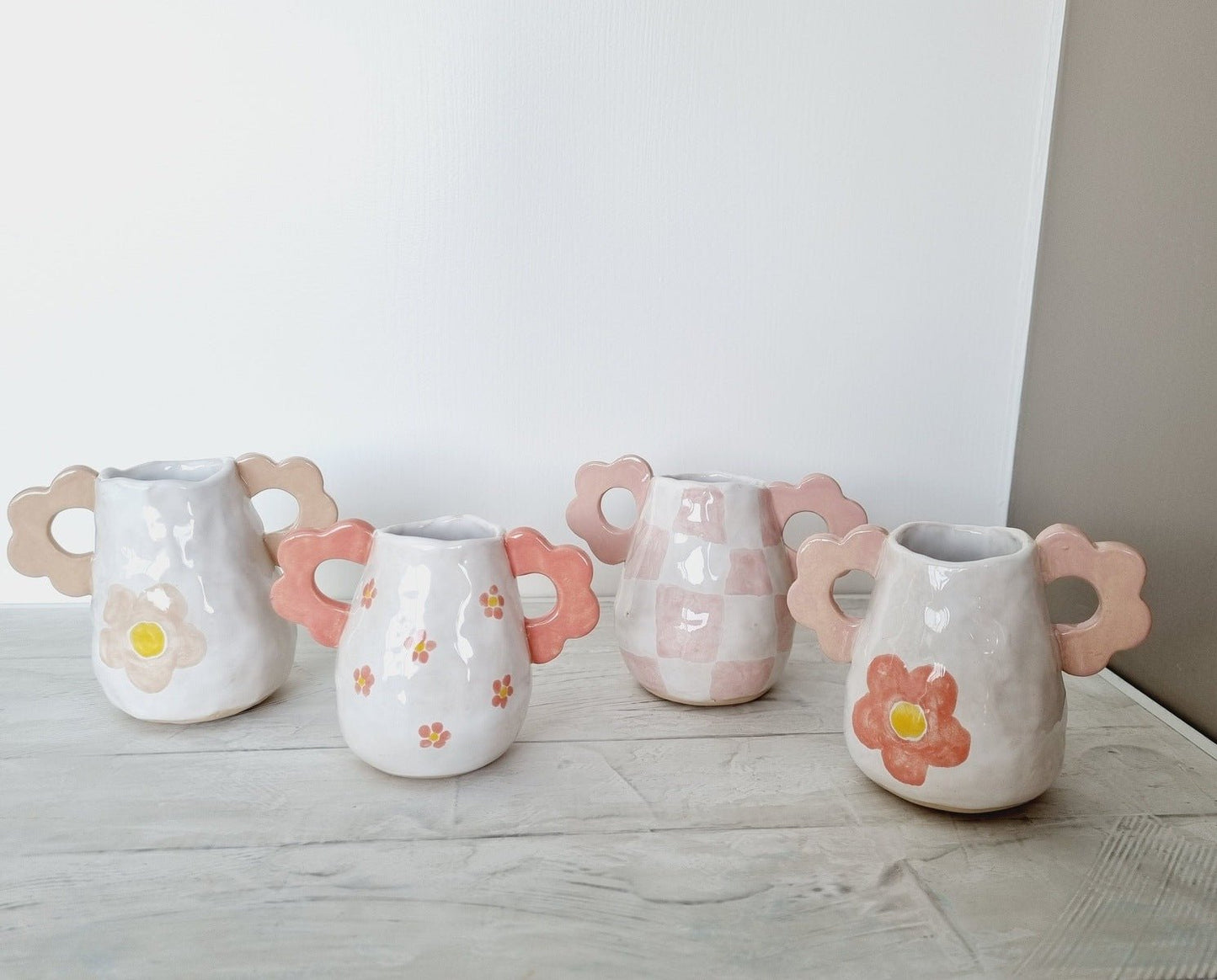 Set of 4 handmade ceramic mini vases.