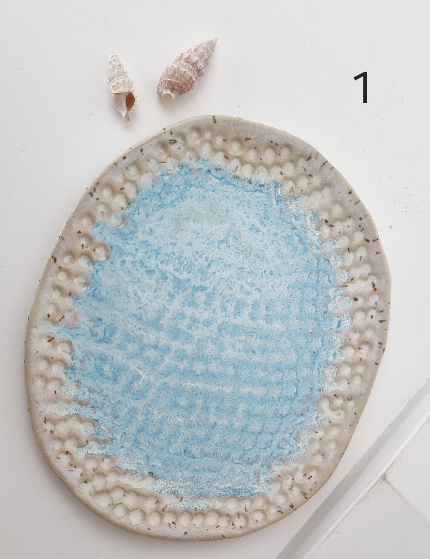 Handmade soap dish for beach house, the texture reflects the imprint of the waves on the beach