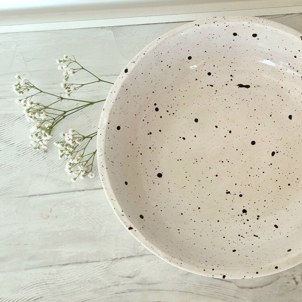 Hand crafted bowl for countertop. White with black spots