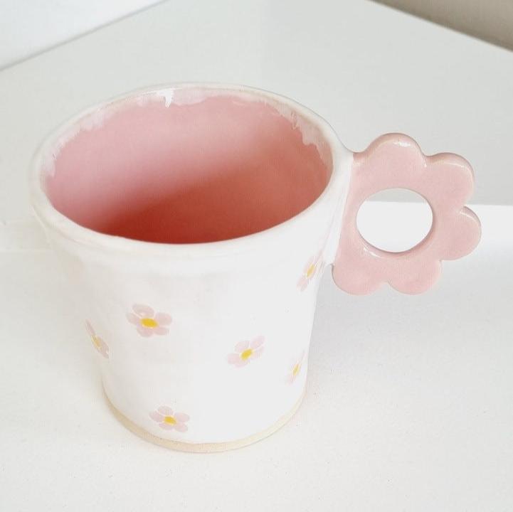 Sweet cup with pink flowers