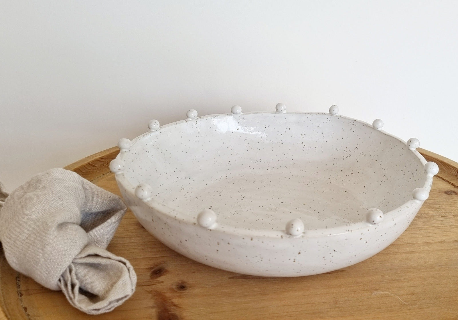 Bowl with small ceramic balls on the rim