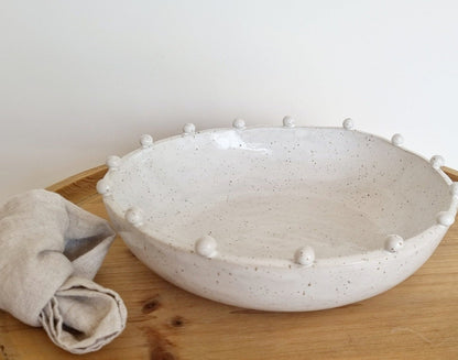 Bowl with small ceramic balls on the rim