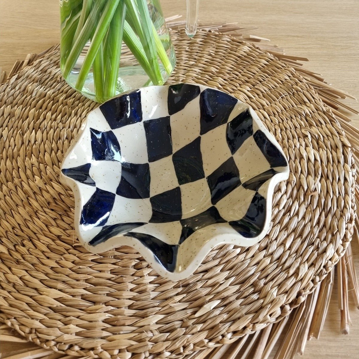 Handmade ceramic bowl made from speckled clay, handpainted with a black checkered pattern