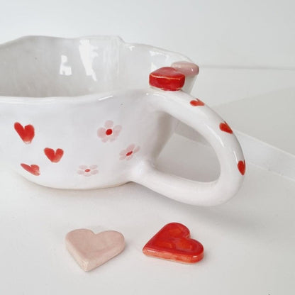 Romantic handmade cup in red and pink, heart shape