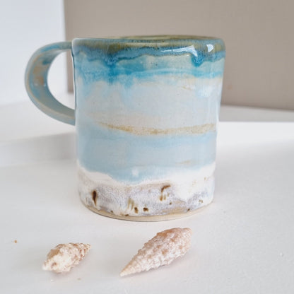 Small cup with ocean inspired colors