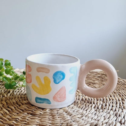 Modern mug with colorful vectors