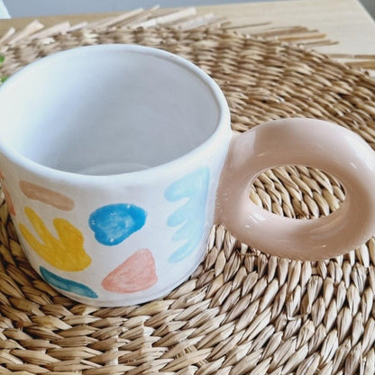 Colorful mug with bold donut handle