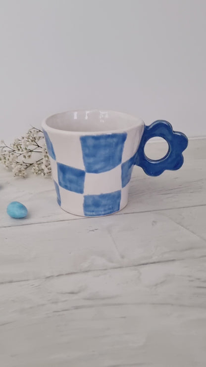 Cute girly cup handpainted with checkers pattern. Flower shape handle