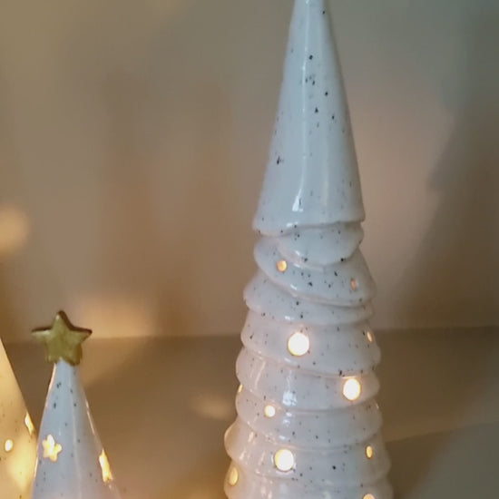 Group ceramic Christmas trees. Pierced Holiday decor for small spaces.