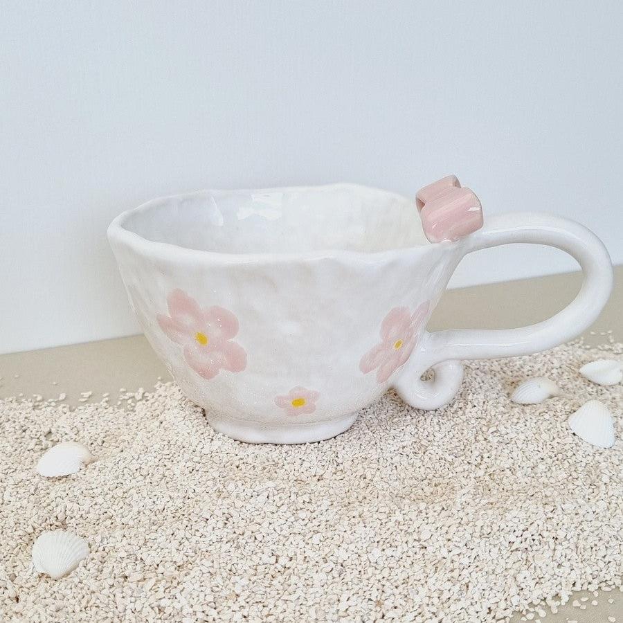 Roamntic, girly mug handpainted with pink flowers and a pink bow on the handle. Vintage style handle