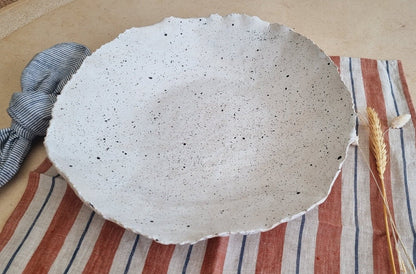 Large bowl with uneven hand formed rim