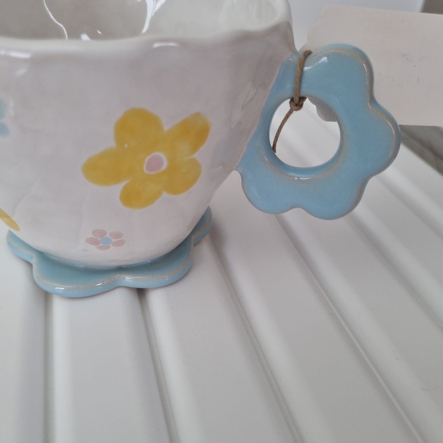 Mug with flower handle